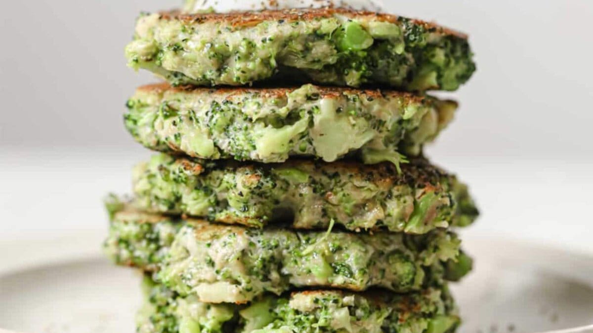 A stack of broccoli fritters on a plate.