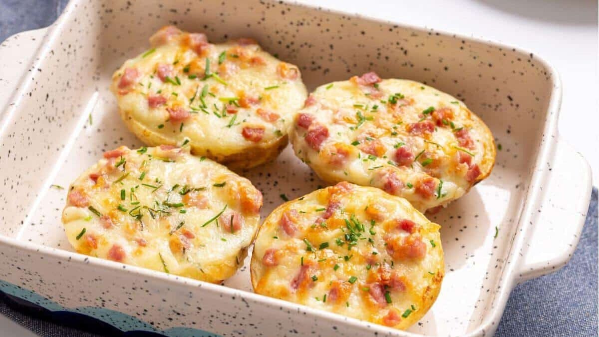 Four twice baked potatoes in a small baking dish.