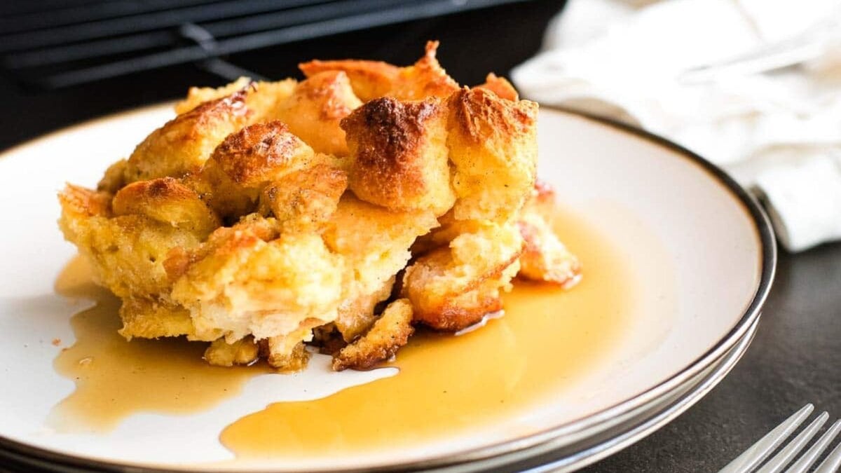 Overnight maple clementine French toast casserole in a white baking dish.