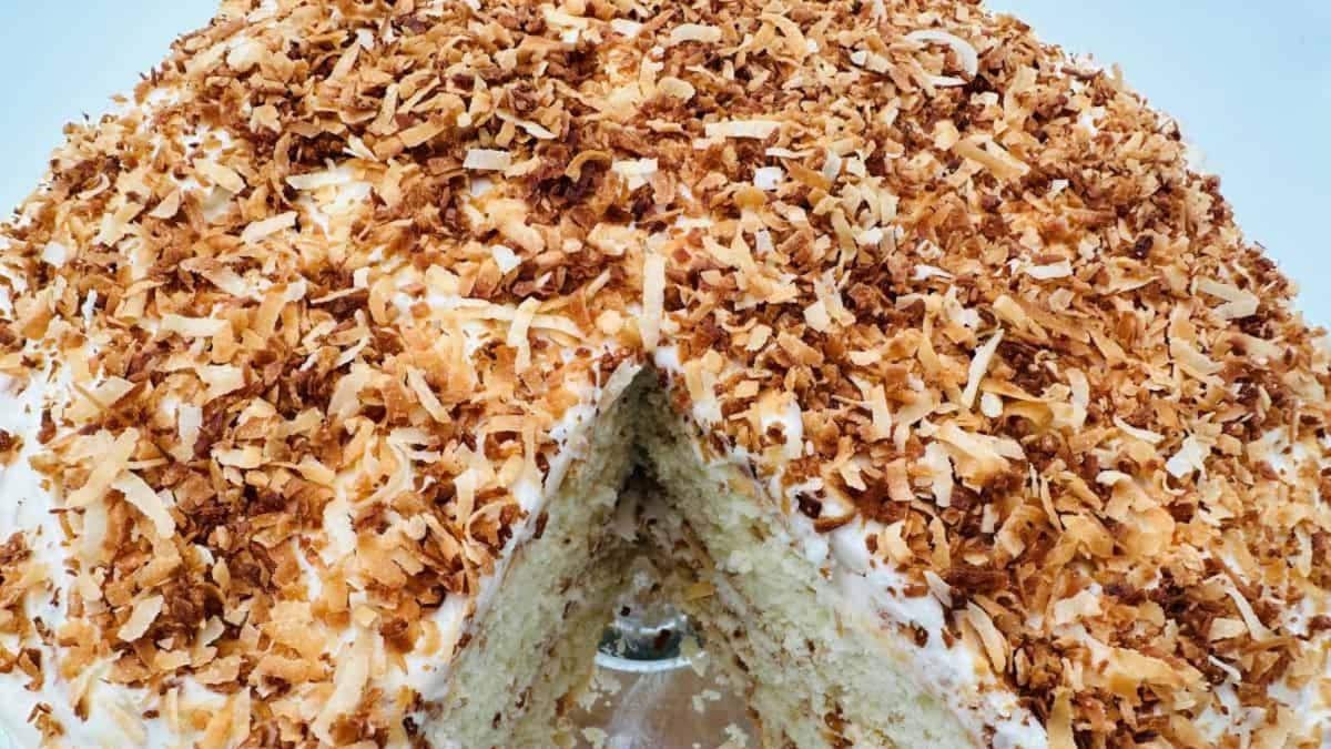 A cake with a slice taken out of it.