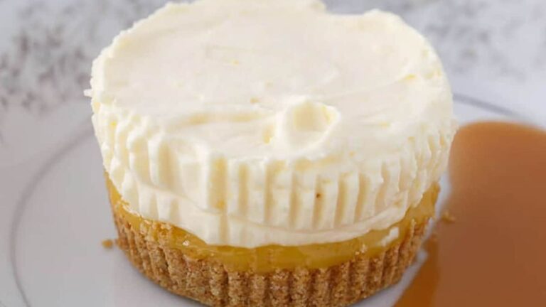 Pineapple Ice Cream Cake on a white plate next to a pool of sauce.
