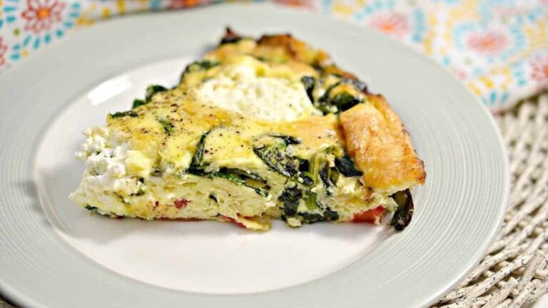 A slice of frittata on a plate.