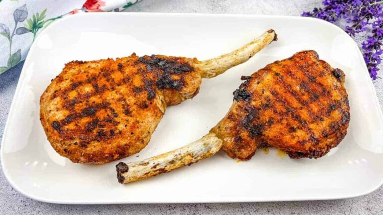 Ninja Grilled Tomahawk Pork Chops on a white plate.