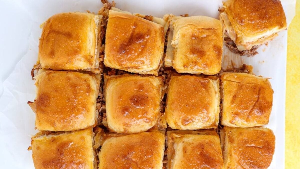 A plate of pulled pork sliders with a juicy and flavorful filling.