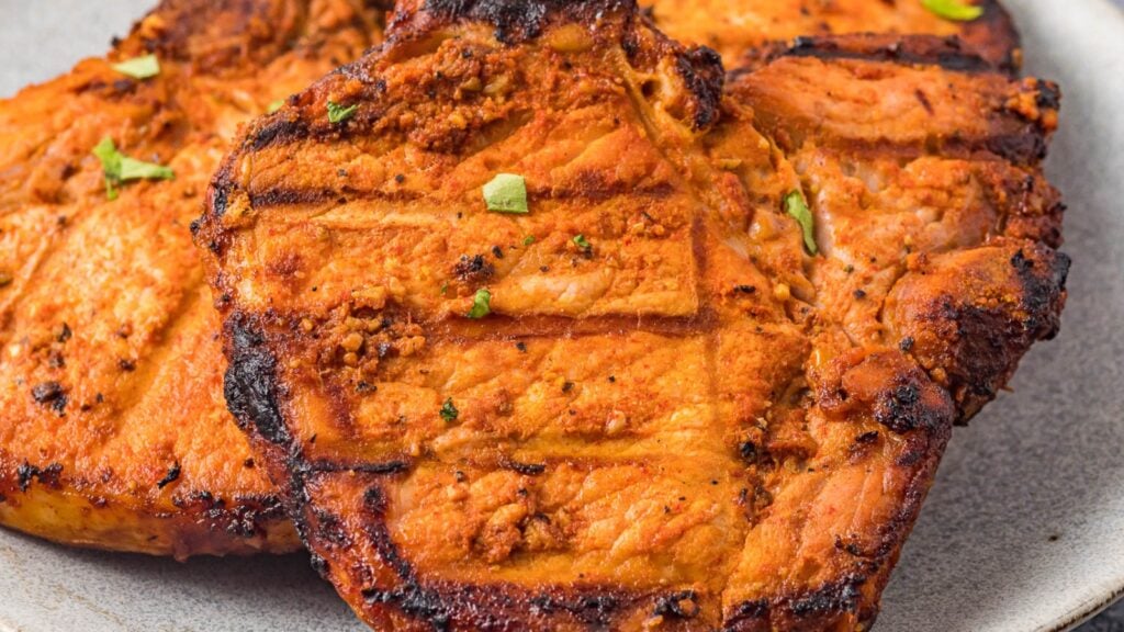 Close up photo of grilled boneless pork chops.