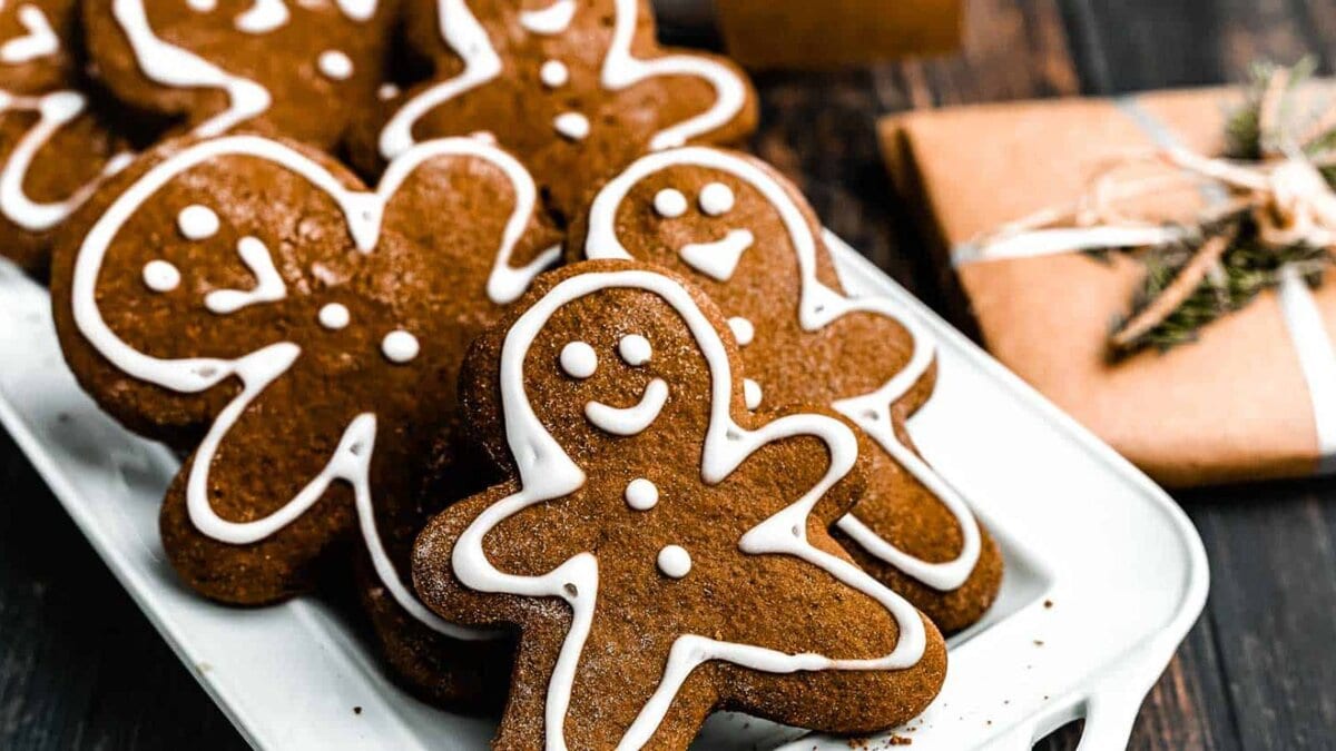 Close up of gingerbread cookies on a white plate.
