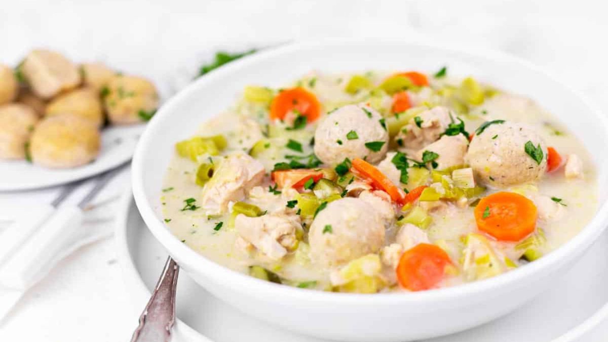 A bowl of homemade chicken soup with dumplings.