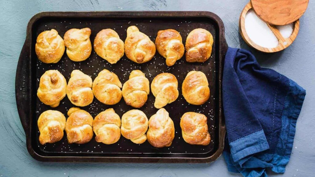Soft pretzel knots on a tray.