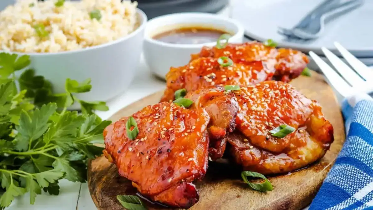 Instant Pot Honey Garlic Chicken on wooden cutting board.