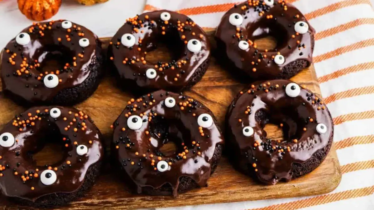 Chocolate Cake Mix Donuts decorated for halloween with frosting and sprinkles.