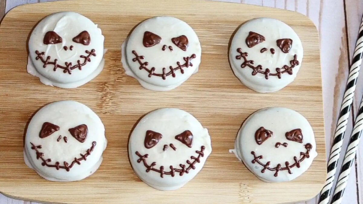 Halloween Jack Skellington Oreo cookies decorated with white chocolate and dark chocolate faces.