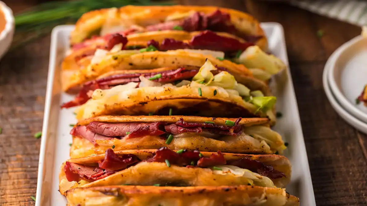 Irish tacos filled with corned beef hash and toppings.