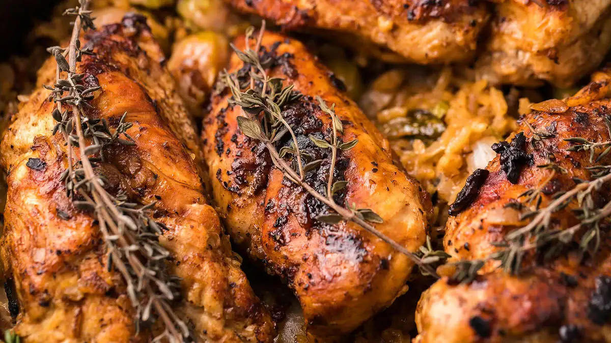 Chicken, rice, bacon, and Brussels sprouts cook together in one pot until tender and fully absorbed.